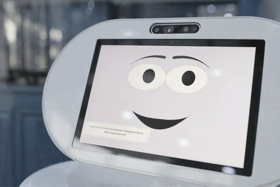 Roboter mit freundlichen Gesicht auf Monitor